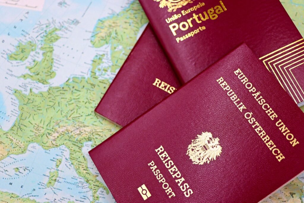Two European Union passports lying on a world map