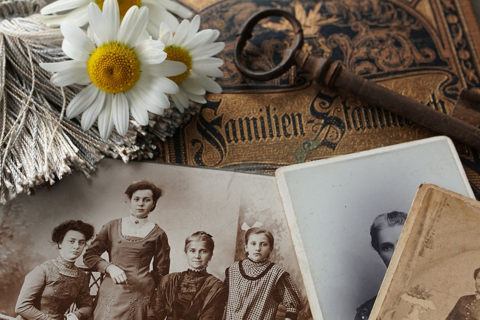 Vintage family photographs with an antique key — heritage