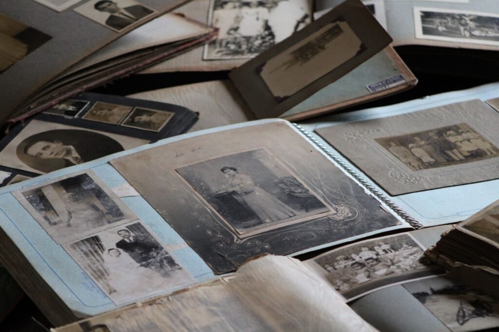 An old family photo album with black and white photographs