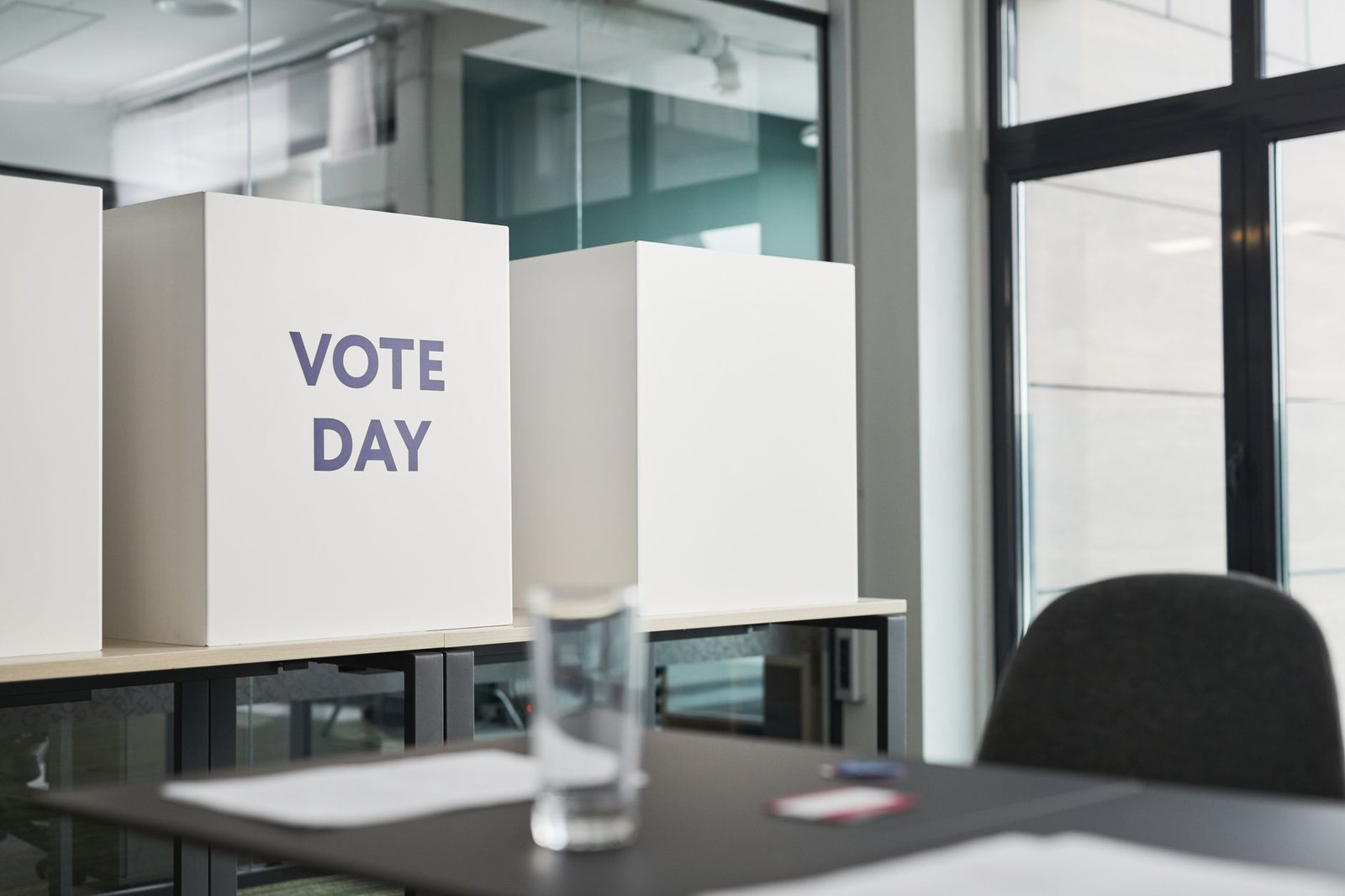 Office voting booths labeled 'Vote Day' during an election