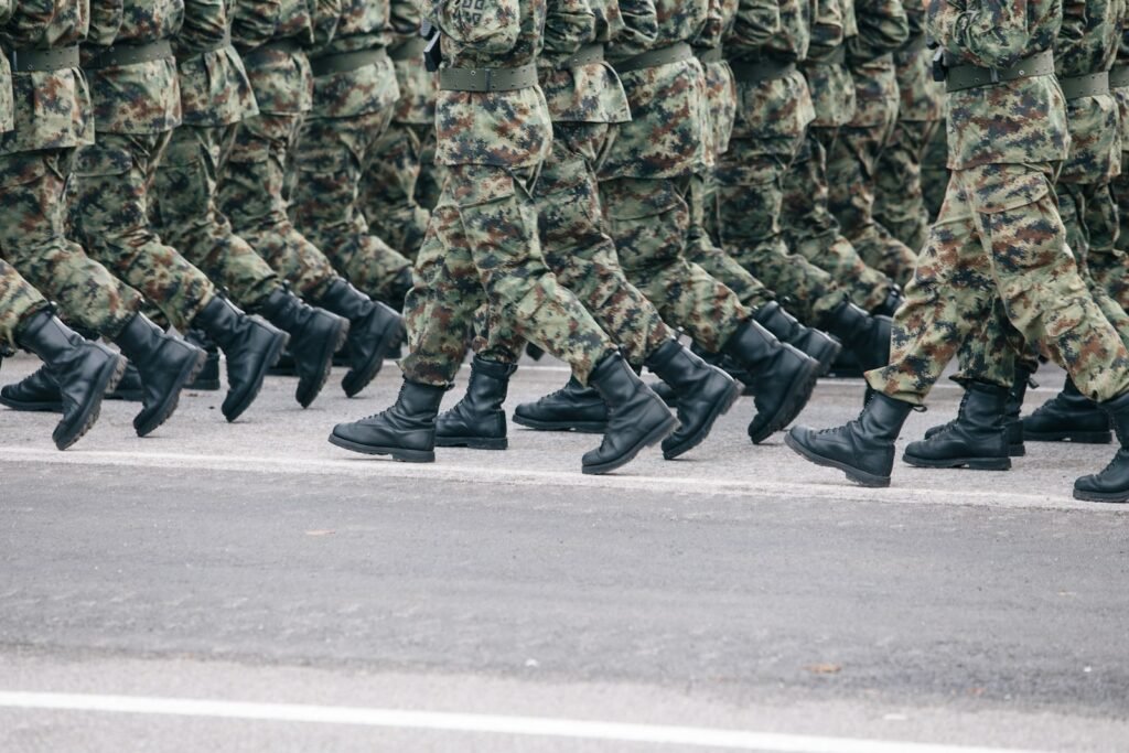 Lithuanian soldiers in camouflage uniform marching – military service
