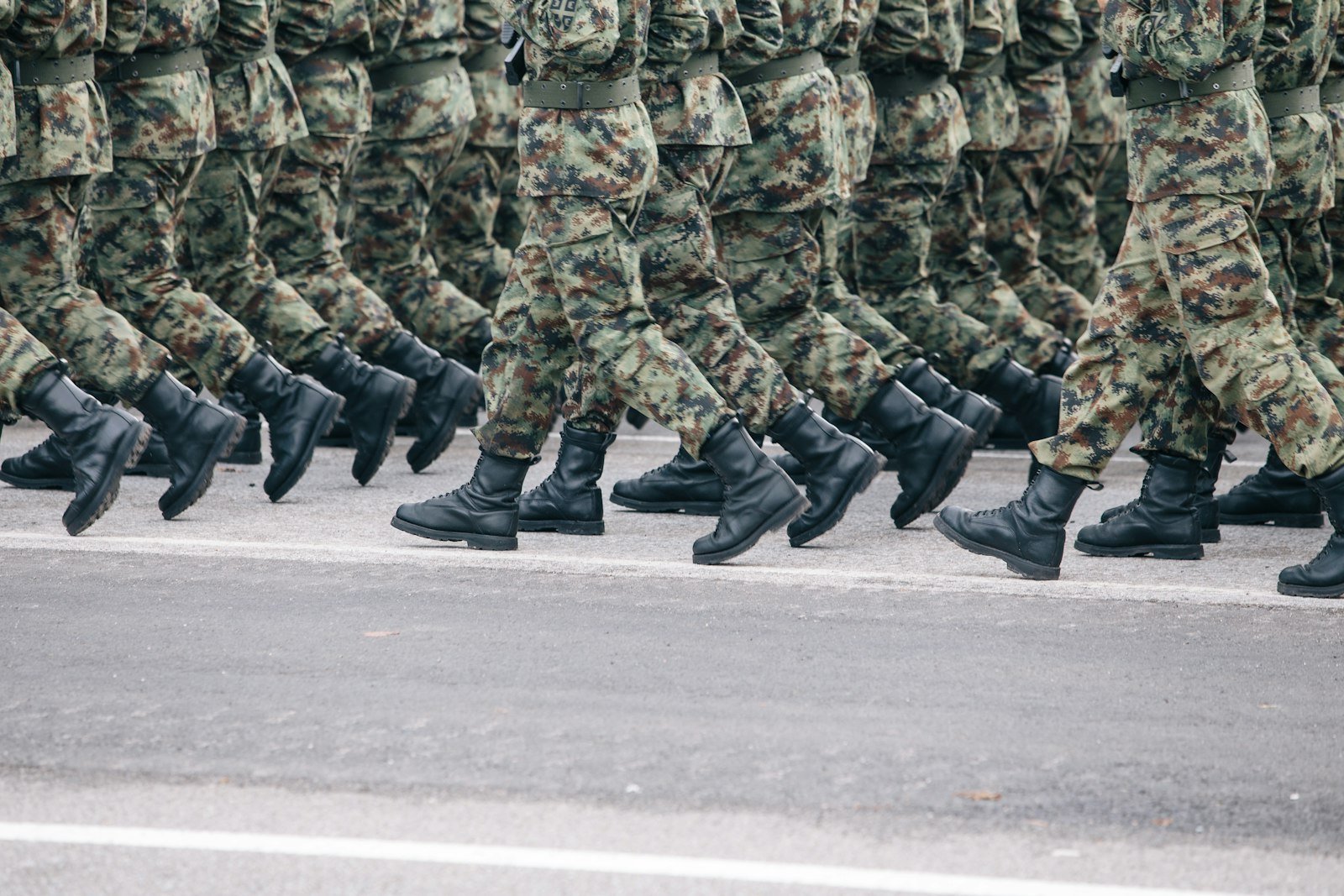 Lithuanian soldiers in camouflage uniform marching – military service