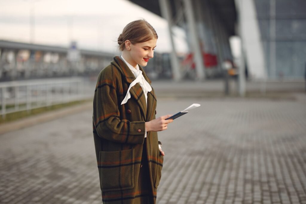 Young woman with passport at airport – Lithuanian citizenship after age 18